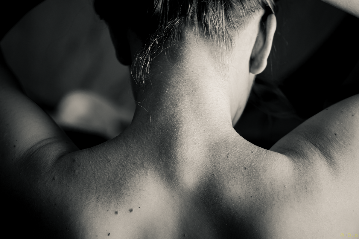 A close-up of a woman's neck and upper back.